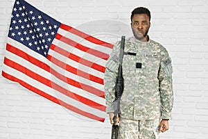 American ranker looking at camera, standing near flag.