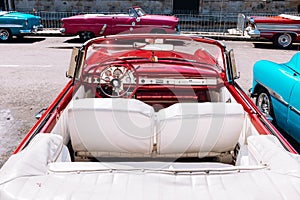 Red vintage car parked in Old Havana, Cuba