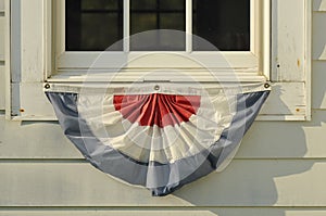 American red white and blue apron flag hanging at the west quoddy lighthouse on the Maine Coast.