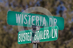 American Road Signs along roadways shows Wisteria and Busted Boiler