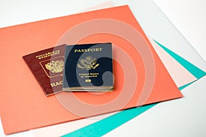 American and Russian passports on colored paper