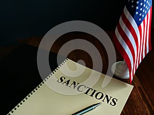 American sanctions and USA flag on table