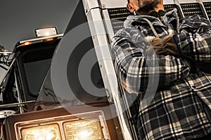 American Semi Truck Driver in Front of His Tractor Truck