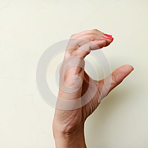 american sign language alphabet letter C displayed with isolated hand on light background