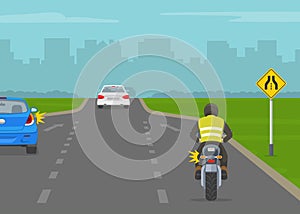 American single-transition traffic sign. Back view of a car and motorcycle rider merging on highway.
