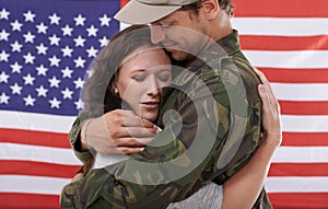 American soldier hug woman, reunion after war and welcome hero with love and flag. Army man reunite with partner