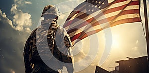 An American soldier looks at an American flag on clear day for Day of Remembrance or July 4 Day of Remembrance