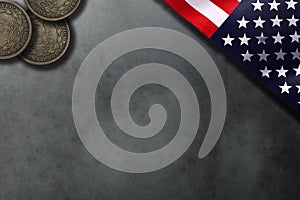 American style background with copy space. National flag and dollar coins on stone table