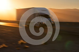 American style truck on freeway pulling load. Transportation the