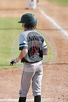 American teen baseball player batting