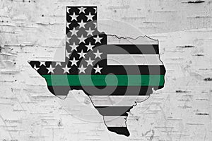 American thin green line flag on map of Texas