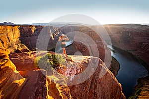 American tourist. Arizona Horseshoe Bend of Colorado River in Grand Canyon. Travel and adventure concept.