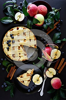 American tradition apple pie with apples, blueberry and cinnamon decorated apple leaves