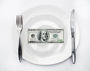 American US dollar on the white plate.