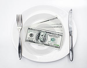 American US dollars on the white plate.