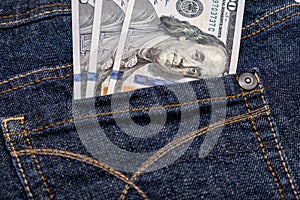 American us one hundred dollar banknotes in a pocket
