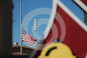 american usa flag half mast blowing waving in wind on flagpole with firefighter 8 p