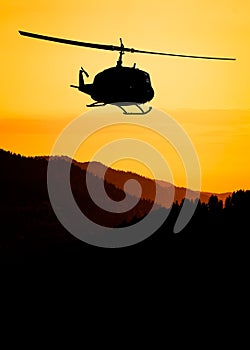 American utility military helicopter in the flight