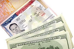 American visa on page of the Russian international passport and US dollars