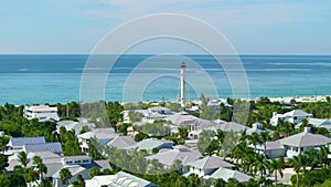 American waterfront houses and white lighthouse in island small town Boca Grande on Gasparilla Island in southwest