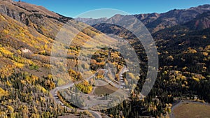 American West Landscape. Aerial Colorado Curved Mountain Road Autumn Fly Backwards