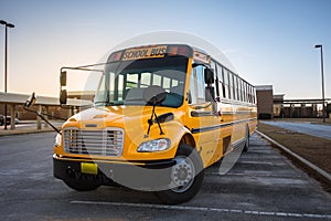 American Yellow Black School Bus on School Grounds Transportation Vehicle