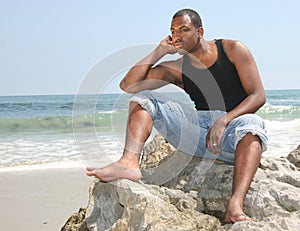 American Youth in Deep Thought on the Beach