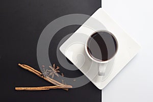 Americano with cinnamon on black and white background