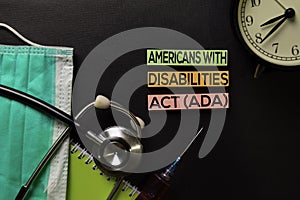 Americans with Disabilites Atc ADA text on top view black table with blood sample and Healthcare/medical concept