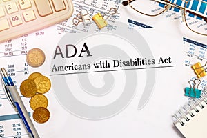 Americans with Disabilities Act ADA paper on desk, financial documents