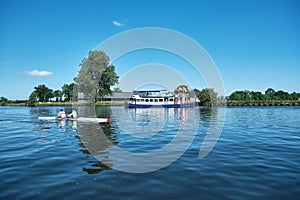Amersfoort, Hoogland, the Netherlands June 13, 2021, Bicycle boat, ferry eemland on the river Eem with canoeist and a