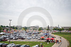 Ames, Iowa, USA - 9.2022 - Tailgate lots with crowds of people before a football game
