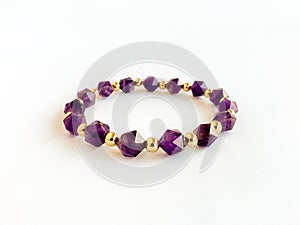 Amethyst Bracelet with Gold Filled Spacer Beads Isolated on White