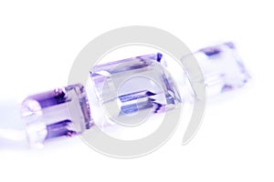Amethyst, rocks or gem in studio by white background for natural resource, jewelry and baguette style for luxury. Stone