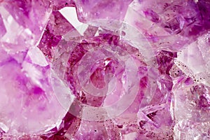Amethyst. The texture of the mineral. Macro shooting of natural gemstone. The raw mineral. Abstract background.