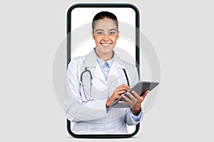 An amiable female doctor with a digital tablet smiles warmly, framed within a smartphone