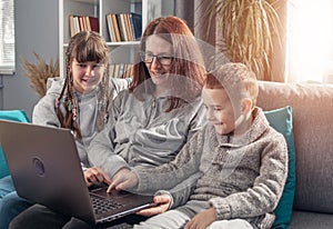 Amicable family using laptop together