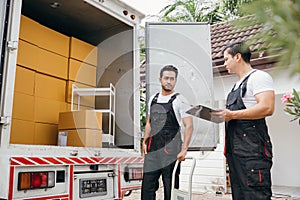 Amid teamwork removal service workers carry out a seamless delivery into a new