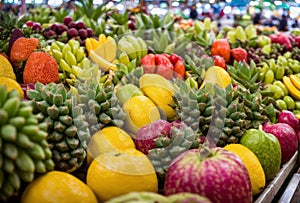 Amidst the hustle and bustle of the market, exotic tropical fruits beckon with their exotic allure, their succulent