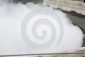 The smoke from a drifting car in competition.