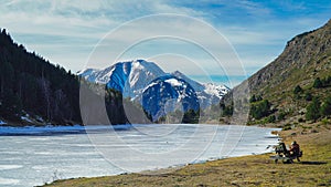 Mountain Oasis: Hikers Take Reprieve in Panoramic Pyrenees Splendor. photo