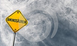 AminosÃ¤uren - yellow sign with cloudy sky