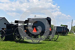 Amish Carts and Buggies Parked at a Farm