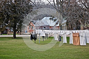 Amish clothing strung across a clothes line.