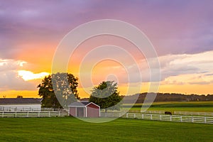 Amish Farm with colorful sunset