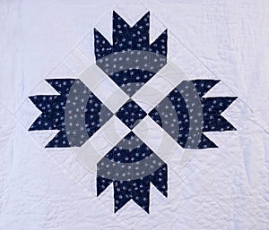 An Amish, hand sewn bear paw quilt pattern showing attention to detail.