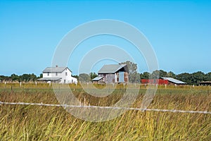 Amish Homestead On A Clear Autumn Day.