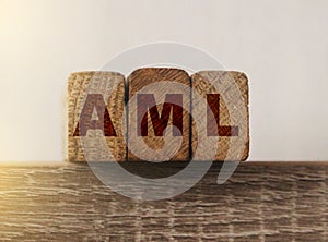 AML anti money laundering acronym on wooden blocks. Government policy and word economy concept