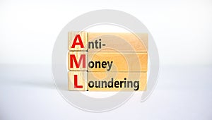 AML, anti-money laundering symbol. Wooden blocks with words AML, anti-money laundering on beautiful white background. Business,