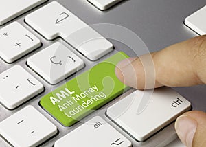 AML Anti Money Laundering - Inscription on Green Keyboard Key photo